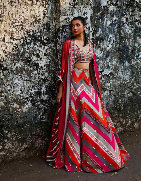 Threadwork Embellished Chevron Lehenga Teamed With A Colour Blocked Embellished Cape And Bustier