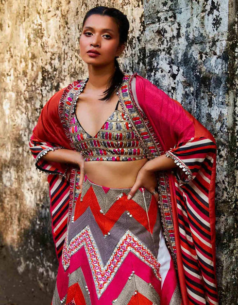Threadwork Embellished Chevron Lehenga Teamed With A Colour Blocked Embellished Cape And Bustier